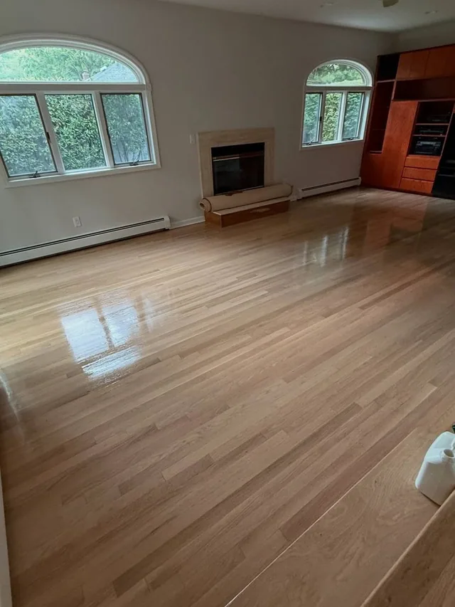 Refinished natural oak in a living room with arched windows