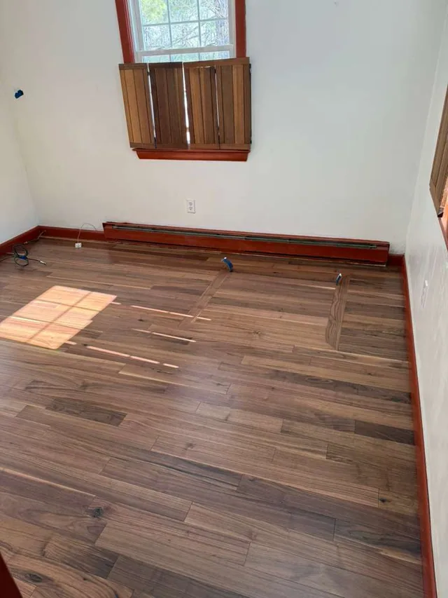 Brown stained floor in a bedroom