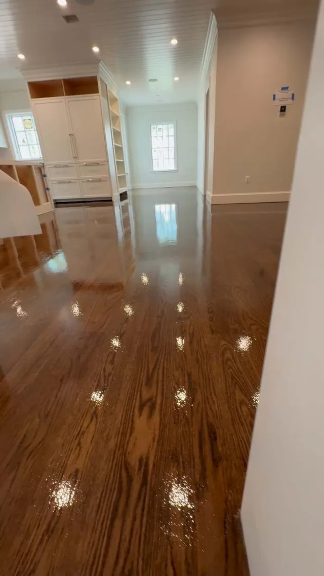 Glossy hardwood hallway leading to the kitchen