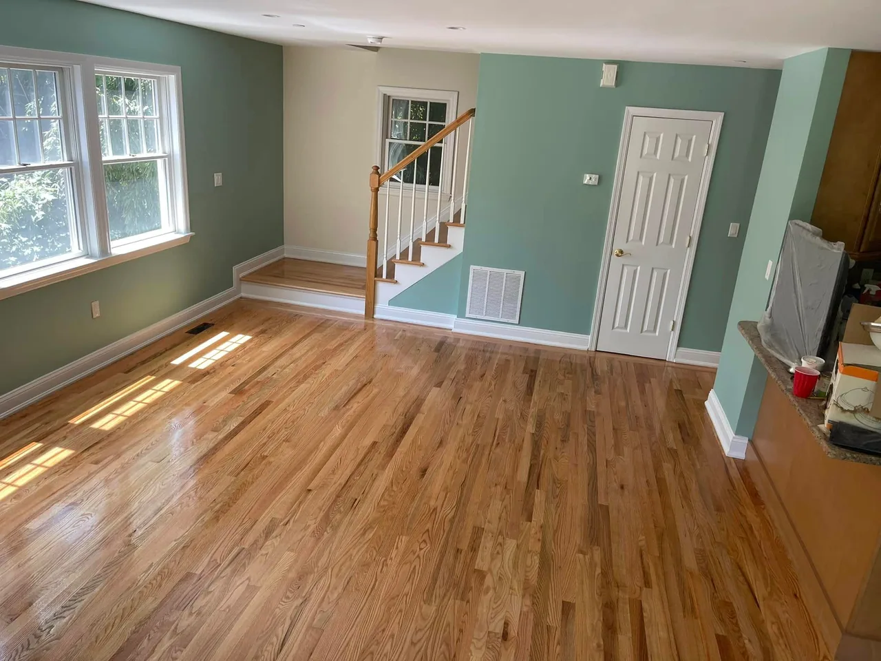 Refinished natural oak in a room with green walls