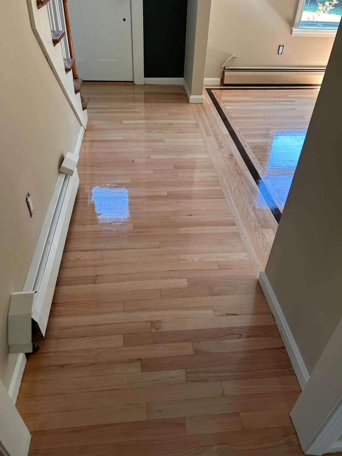 Narrow hallway with a contrasting hardwood border