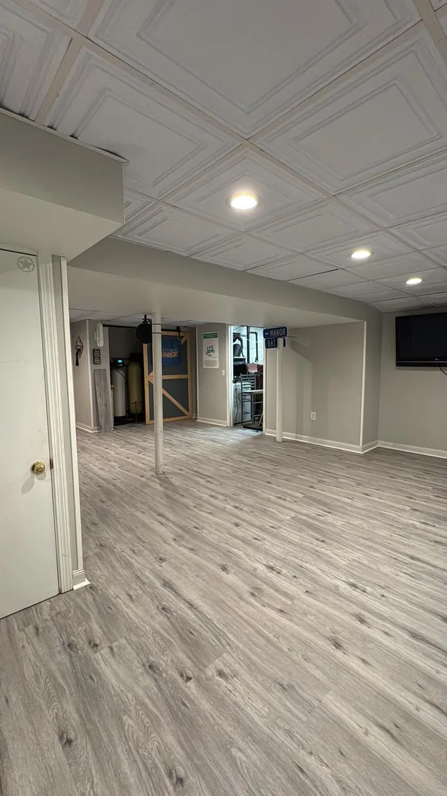 Gray plank flooring in a finished basement
